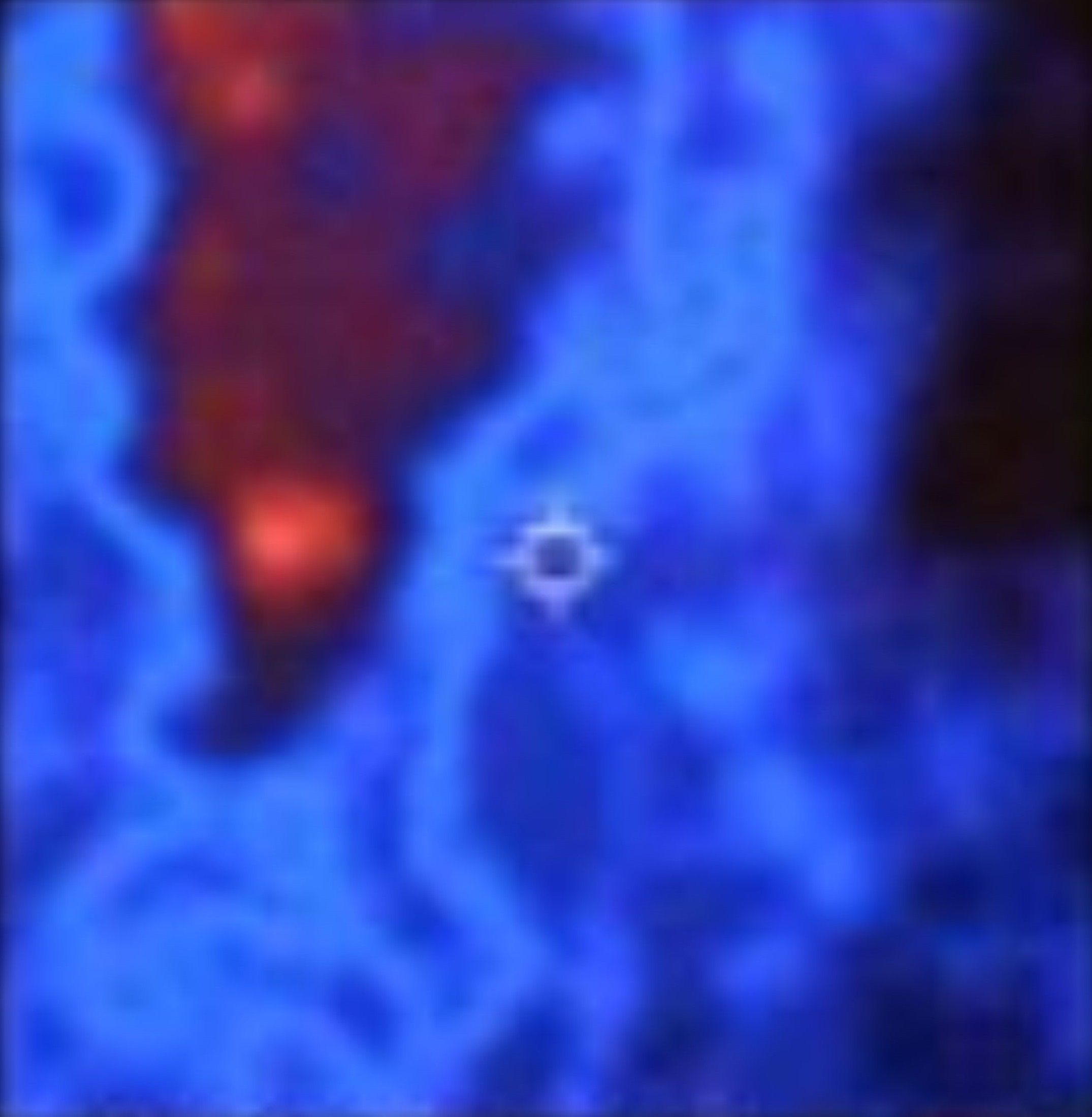 Thermal imaging capture showing a red heat signature with a small bright orb-shaped anomaly floating nearby