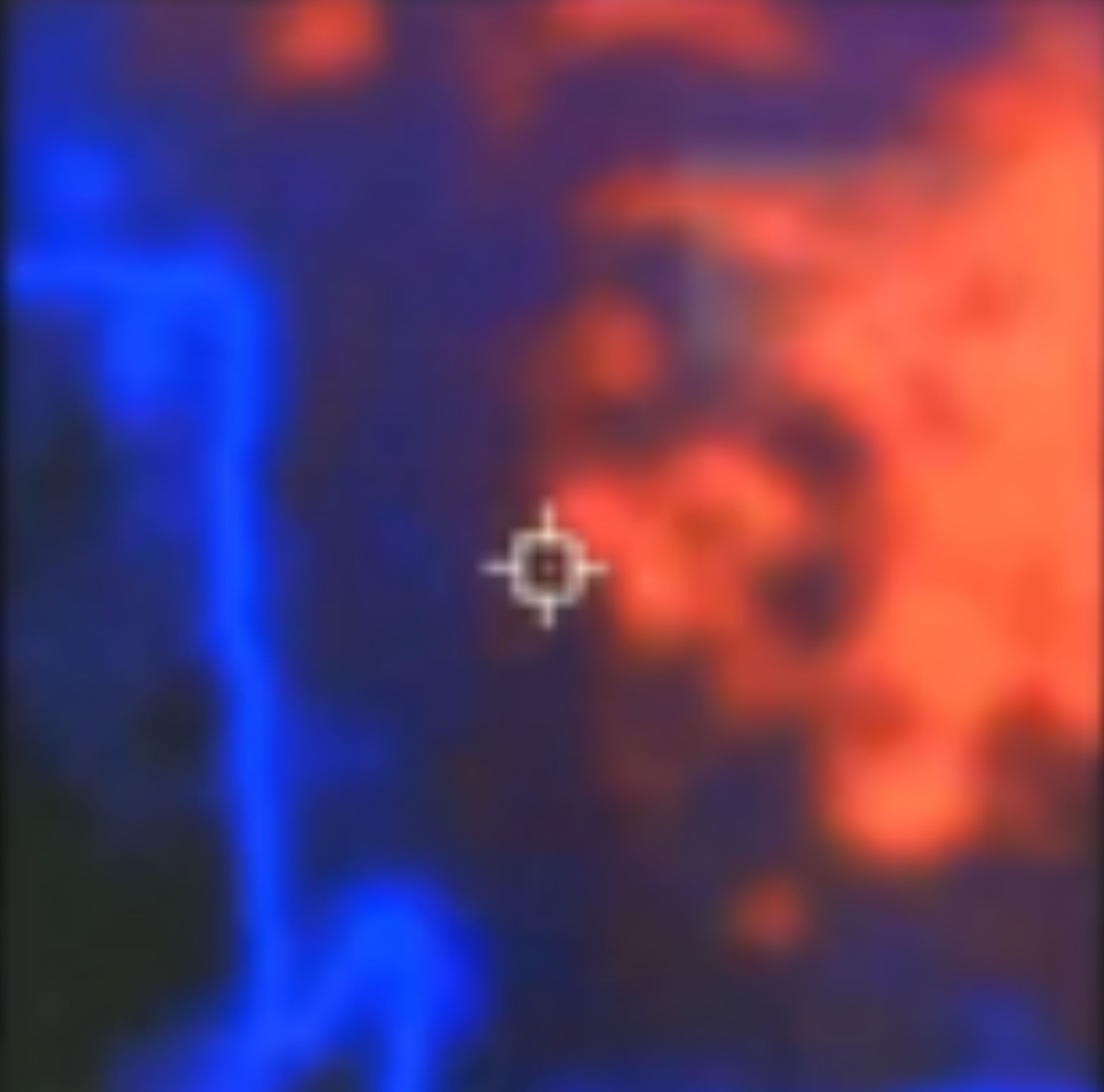 Thermal imaging footage of a bright orange heat mass beside a blue humanoid-shaped outline, with a targeting reticle on a faint anomaly