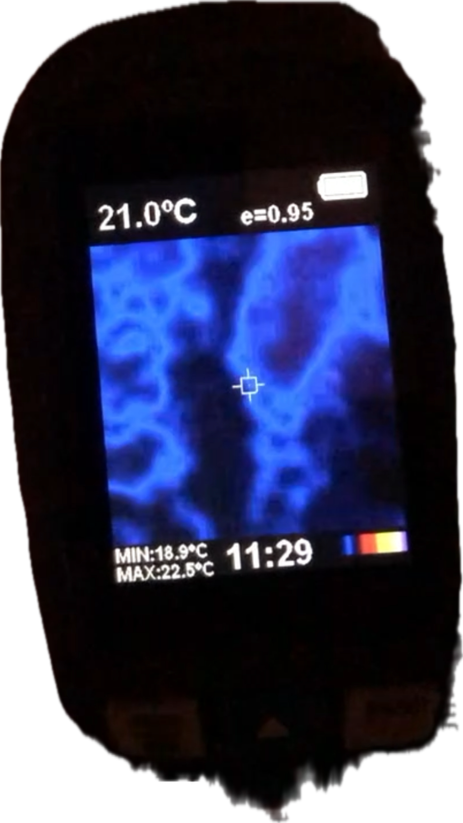Photo of a handheld thermal imaging camera device displaying a blue heat map reading of 21.0 degrees Celsius with a targeting reticle